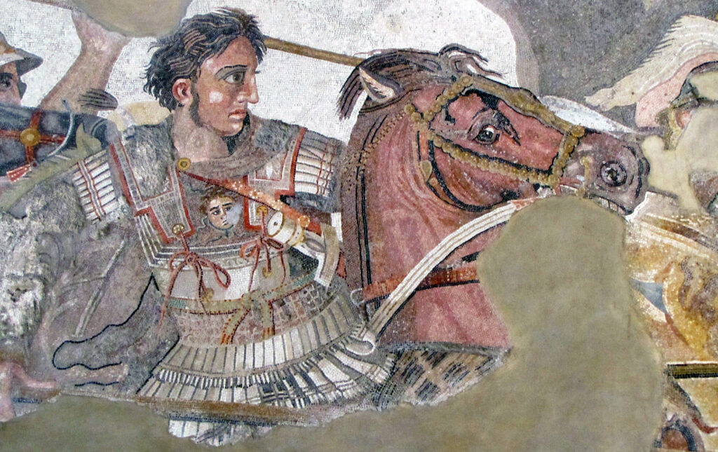 A mosaic of Alexander the Great on horseback with a lance in his right hand wearing a white cuirass with shoulder flaps and skirts of narrow flaps at the shoulders and waist