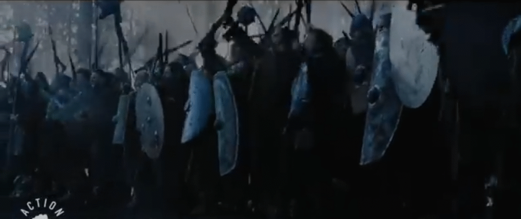 a line of men with swords and shields.  The scene is dominated by black,grey, brown, and dark blue tones.