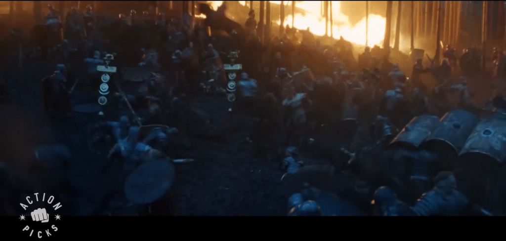 an army on a desaturated blue-black battlefield with bright flames in the backgroud